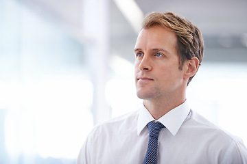 Image showing Businessman, serious and thinking in the morning in office with corporate ideas, daydreaming and wondering. Entrepreneur, professional and thoughtful man at workplace with mockup space and confidence