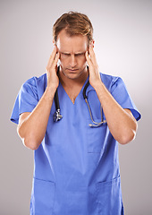 Image showing Doctor, studio and headache for stress, burnout or tension and stethoscope. Man, worry or migraine for professional, medic and health care or medical pressure and overworked on white background