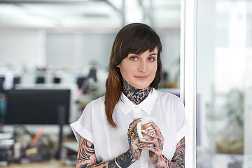 Image showing Smile, tattoos and business woman with coffee in office with positive, good and confident. Grunge, cappuccino and portrait of professional edgy creative designer with ink skin standing in workplace.