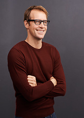 Image showing Man, thinking and happy nerd in studio with arms crossed and inspiration on dark background. Planning, ideas and programmer brainstorming a development of solution for IT project update in mockup