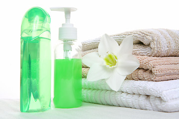 Image showing aromatic oil, shampoo and towel