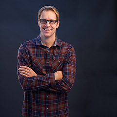 Image showing Happy, man and portrait of nerd in studio with arms crossed and pride on dark background. Confident, programmer and person with a smile in development of solution for IT project in mockup space