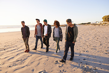 Image showing Summer, sunset and group of friends at beach for bonding, adventure and vacation together in Miami. Nature, sand and people by ocean for travel, holiday or weekend trip with peace at seaside