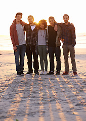 Image showing Sand, support and portrait of friends at beach for sunset, summer adventure and bonding together. Nature, travel and people by ocean for weekend trip, holiday or vacation with wellness at seaside