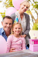 Image showing Portrait, family or gift at happy birthday, party or balloon as love, bonding or together outside. Papa, mama or girl as smile at box, hug or celebration of gratitude, congratulations or childhood