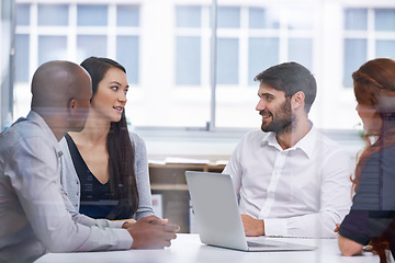 Image showing Business people, boardroom and meeting teamwork for startup planning with tech b2b support, collaboration or problem solving. Men, women and laptop in office building for discussion, sales or deal