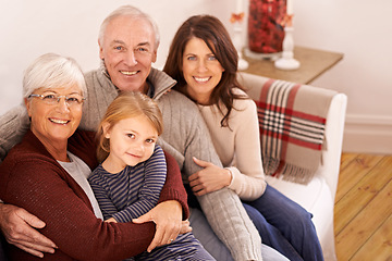 Image showing Grandparents, parents and kid on couch for portrait with hug, care or love with generations for bonding in home. Mother, father and senior people with child for embrace on lounge sofa in family house