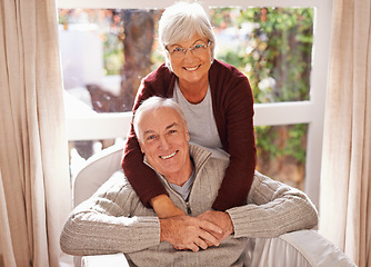 Image showing Couple, senior and portrait with hug, window and home for happy retirement. Mature man, woman and marriage with elderly, care and love for healthy relationship and romantic rest and relaxation