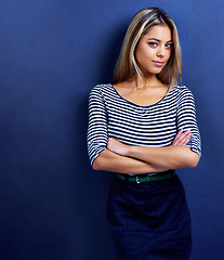 Image showing Portrait, arms crossed and business woman in studio isolated on a blue background mockup. Confidence, creative or female person, entrepreneur or professional designer in casual clothes in Switzerland