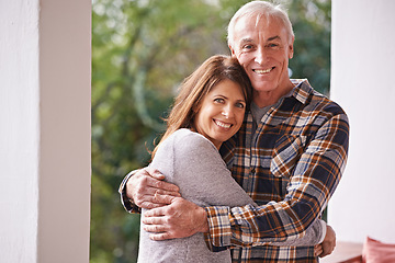 Image showing Portrait, senior and man hug daughter with love, outdoor and patio of home, smile and happiness. Family, male person and woman embrace with care, girl and visit father in retirement and house