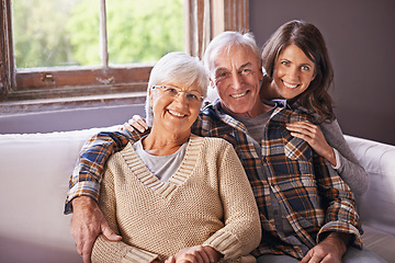 Image showing Woman, senior parents and portrait on sofa with hug, smile and connection with care, love and bonding. Old couple, mother and daughter with father on couch in living room with embrace in family home