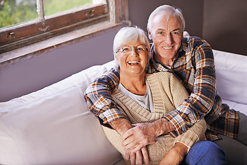 Image showing Senior couple, hug and portrait on couch with smile, love and connection in living room for retirement. Elderly woman, old man and embrace on sofa in lounge with pride, care and happy in apartment