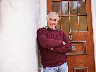 Image showing Crossed arms, door and portrait of senior man at his home with positive, good and confident attitude. Happy, pride and elderly person in retirement at wooden entrance of modern house in Australia.