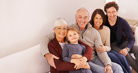 Image showing Grandparents, generations and kid on couch for portrait with hug, care or love with parents for bonding in home. Mother, father and senior people with child for embrace on lounge sofa in family house