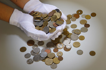 Image showing coins in hands