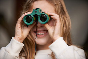 Image showing Girl, child and binoculars for sightseeing outdoors, explore and birdwatching on holiday or vacation. Female person, kid and tourist or travel on outside adventure, smile and looking for wildlife