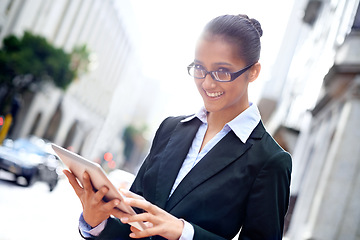 Image showing Lawyer, portrait or happy woman with tablet in city for legal research, online app or social media post. Attorney, smile or advocate with business email, networking or internet article for travel