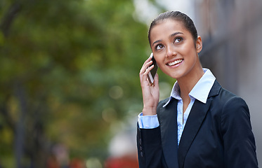 Image showing Businesswoman, talking or thinking of phone call in city commute to work or job on outdoor travel. Speaking, advocate or happy attorney networking with smile or news in modern urban area or Cape Town