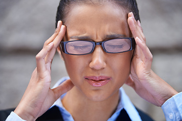 Image showing Business, face and woman with headache in city for legal justice, travel or crisis with burnout or head pain. Wall, anxiety or stress with female attorney, advocate or corporate advisor with migraine