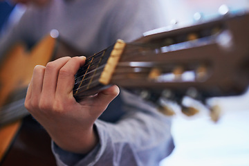 Image showing Learning, music and hand of child with guitar for lesson and development of skill with instrument. Playing, practice and kid with creative education as musician with acoustic sound on strings