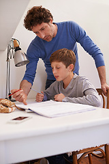 Image showing Teen, dad and help with studying in home, student and support for assignment or project. Daddy, boy and schoolwork on weekend in bedroom, education and assistance or guidance for learning by desk