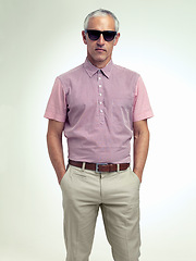 Image showing Confident, older or man in business, fashion or stylish outfit and apparel on white background. Businessman, hands in pocket or eyewear as smart, casual or unique leisure wear to relax on getaway