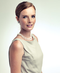 Image showing Portrait, fashion and confidence of woman in studio isolated on a gray background mockup space. Face, freckles and young person in vintage clothes for retro style or elegance with necklace in Ireland