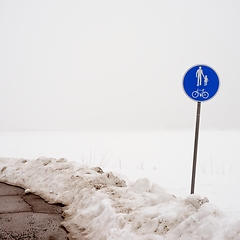 Image showing road sign pedestrian and bicycle path in winter