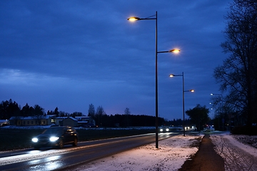 Image showing night traffic of cars on the road in a small Finnish town