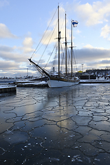 Image showing sailing ship in the port of Helsinki with the Finnish flag on th