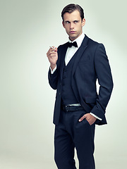 Image showing Man, cigarette or thinking of smoking, addiction or planning of vision, idea or fashion of tobacco. Male person, smoker or confident as inspiration, memory or mockup in studio on white background