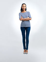 Image showing Fashion, crossed arms and portrait of woman in studio with casual, trendy and stylish outfit. Confident, pride and full body of female person with jeans and tshirt for cool style by white background.