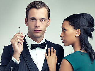 Image showing Cigarette, fashion and portrait of couple in studio with elegant, formal and stylish clothes for event. Luxury, party and man and woman smoking with confidence, pride and glamour on gray background