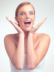 Image showing Portrait, surprise and skincare of woman with beauty in makeup for glow, shine and wow in studio isolated on a white background. Face, hands and excited model with cosmetics for facial dermatology