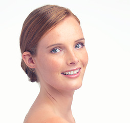 Image showing Portrait, natural beauty and smile of woman for skincare, glow or health in studio isolated on a white background mockup space. Face, happy and ginger model with freckles, cosmetics and dermatology