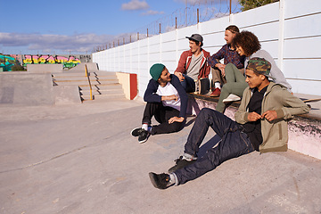 Image showing Skate park, diversity and friends with conversation, sunshine and relaxing with discussion and happiness. Multiracial, gen z and team on a break, summer and bonding together with skaters and group