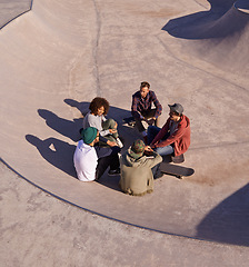 Image showing Group, skate park and friends with conversation, sunshine and recreation with weekend break and team. People, outdoor and skaters with summer and hobby with diversity and support with discussion