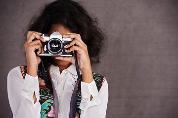 Image showing Photography, vintage and woman in studio with camera, creative travel and fashion mockup. Art, professional and Mexican photographer girl with retro hobby, career and boho style on grey background