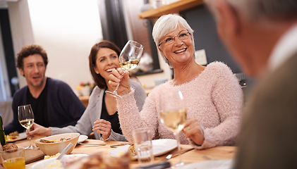 Image showing Family, food and table for love in home, conversation and healthy meal or alcohol in apartment. Happy people, bonding and eating together on weekend, relax and speaking or laugh for funny humor