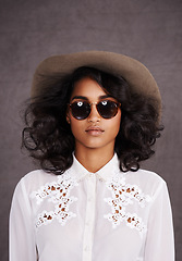 Image showing Portrait, sunglasses and woman with cowboy fashion, confidence and relax with girl in stetson hat. Rodeo, western style and Mexican model with cowgirl culture, wild west clothes and grey background