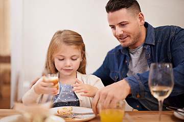 Image showing Father, child and help with meal in home, food and healthy lunch for nutrition at dining table. Daddy, girl and teaching to eat or development in apartment, wellness and bonding or support in house