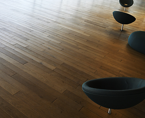 Image showing A group of chairs on a wood floor