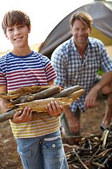 Image showing Boy, father and camping with wood in portrait for heat, cooking and learning on outdoor adventure. Child, papa and collecting firewood in forest, vacation and happy in nature by tent in Colorado