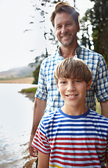 Image showing Man, lake and portrait with son in nature for vacation, summer holiday and happiness in Australia. Dad, kid and smile with bonding for weekend travel, adventure and tourism in forest outdoors