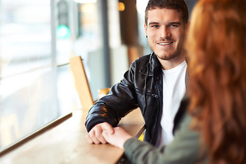 Image showing Man, couple and date in coffee shop, hand holding for love and romantic affection. Boyfriend, support together for bonding relationship, female person at table for trust comfort and compassion
