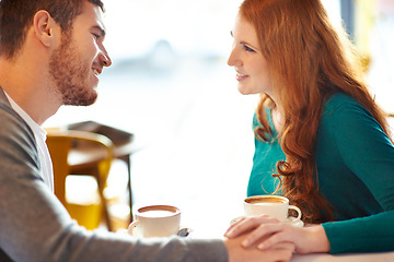 Image showing Couple, happy and smile in cafe for coffee, conversation or discussion on date with love. Support, comfortable together and trust in relationship bonding, people at table with cappuccino in mug