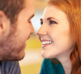 Image showing Couple, eye contact and smile with romantic date together in cafe for support, love and bonding. Partner, relax and face of people for anniversary, valentines day or celebration in restaurant