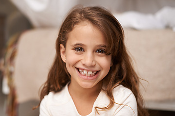 Image showing Portrait, young girl or smile to relax, play or fun in comfortable, childhood or bedroom in Brazil. Happy, female child or playroom as cheerful for free time, leisure or break in weekend recreation