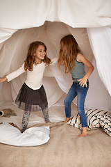 Image showing Children, sisters and happy for dancing in bedroom with fort, bonding and connection with care in family home. Girl kids, together and smile for game, love and excited for ballet, tutu and playing