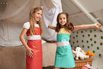Image showing Fashion, paper and portrait of children with dress for fun, show or playing together at home. Happy, smile and young girl kids in gift wrap outfit for style with bonding in bedroom at house.